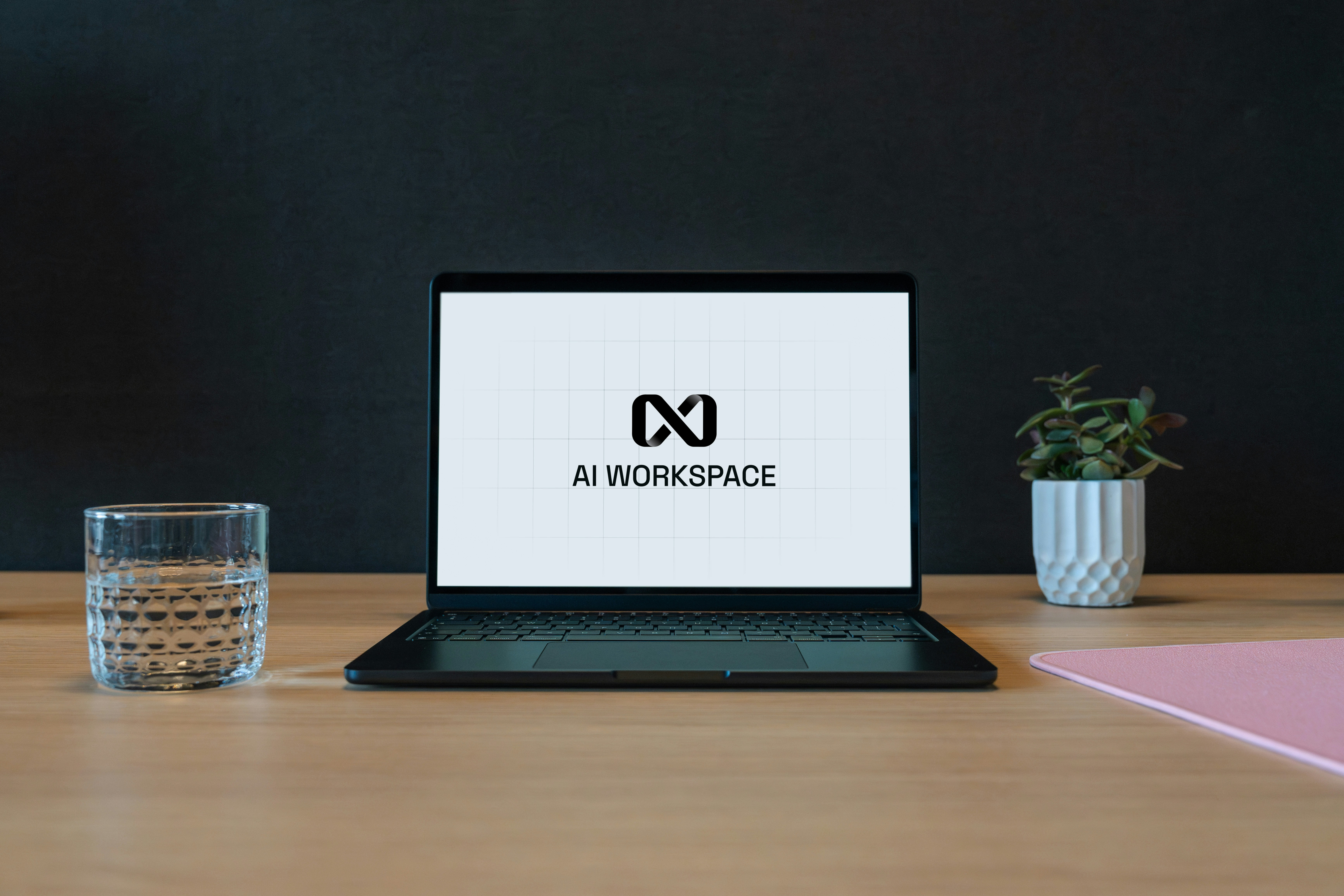 Laptop displaying an AI workspace interface in a modern office.