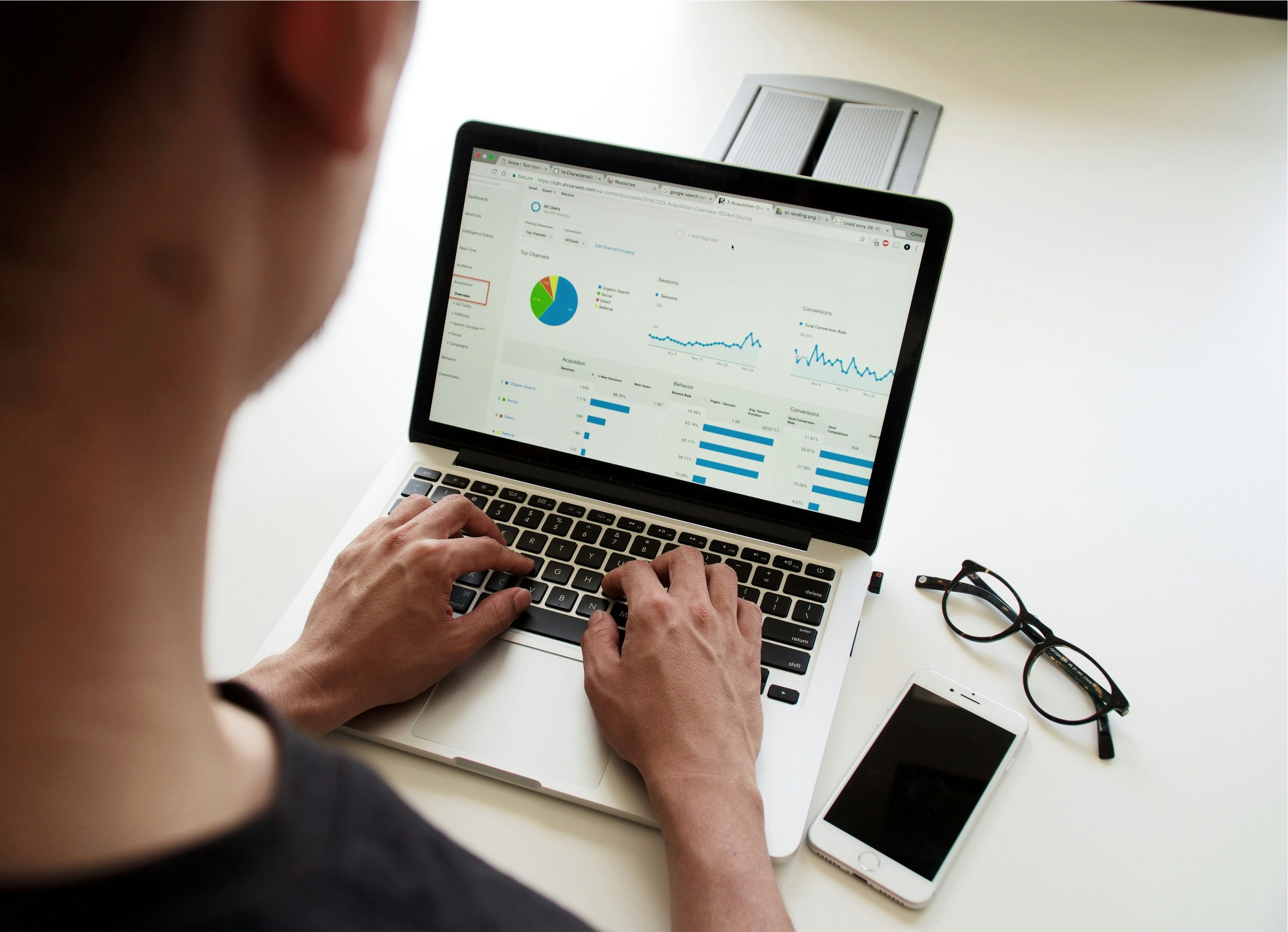 Business professional using a laptop dashboard to monitor digital performance and automated workflows.